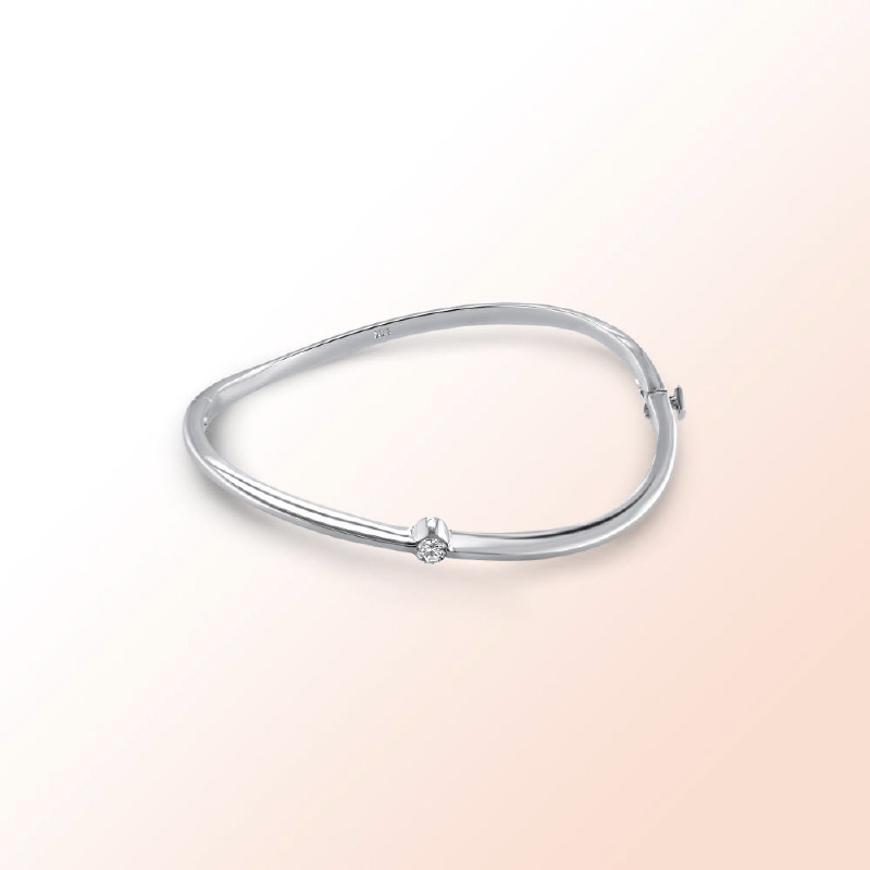 14k.w. Bangle with a solitaire Diamond 0.20Ct.